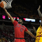 
              St. John's guard Posh Alexander (0) breaks free for a basket past Iowa State guard Demarion Watson, right, during the first half of an NCAA college basketball game, Sunday, Dec. 4, 2022, in Ames, Iowa. (AP Photo/ Matthew Putney)
            
