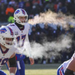 Buffalo Bills quarterback Josh Allen (17) and tackle Spencer Brown (79) exhale before a successful two-point attempt in the second half of an NFL football game against the Chicago Bears in Chicago, Saturday, Dec. 24, 2022. (AP Photo/Charles Rex Arbogast)