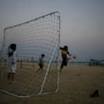 Children play soccer at Katara beach in Doha, Qatar, Sunday, Dec. 11, 2022. (AP Photo/Natacha Pisarenko)