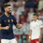 
              France's Olivier Giroud celebrates scoring his side's first goal during the World Cup round of 16 soccer match between France and Poland, at the Al Thumama Stadium in Doha, Qatar, Sunday, Dec. 4, 2022. (AP Photo/Martin Meissner)
            
