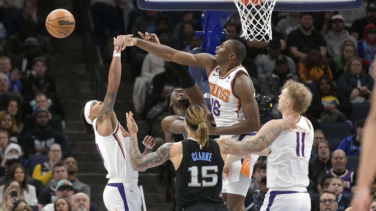 Phoenix Suns center Bismack Biyombo defends against Memphis Grizzlies forward Jaren Jackson Jr. in ...