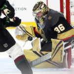 Vegas Golden Knights goaltender Logan Thompson (36) blocks a shot from Arizona Coyotes right wing Clayton Keller (9) during the first period of an NHL hockey game Wednesday, Dec. 21, 2022, in Las Vegas. (AP Photo/Chase Stevens)