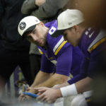 Minnesota Vikings quarterback Kirk Cousins sits on the bench during the first half of an NFL football game against the Indianapolis Colts, Saturday, Dec. 17, 2022, in Minneapolis. (AP Photo/Andy Clayton-King)