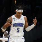 Orlando Magic forward Paolo Banchero (5) celebrates after making a basket during the first half of an NBA basketball game against the Boston Celtics, Sunday, Dec. 18, 2022, in Boston. (AP Photo/Mary Schwalm)