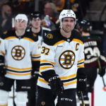 Boston Bruins center Patrice Bergeron skates off the ice after the team's NHL hockey game against the Arizona Coyotes in Tempe, Ariz., Friday, Dec. 9, 2022. The Coyotes won 4-3. (AP Photo/Ross D. Franklin)