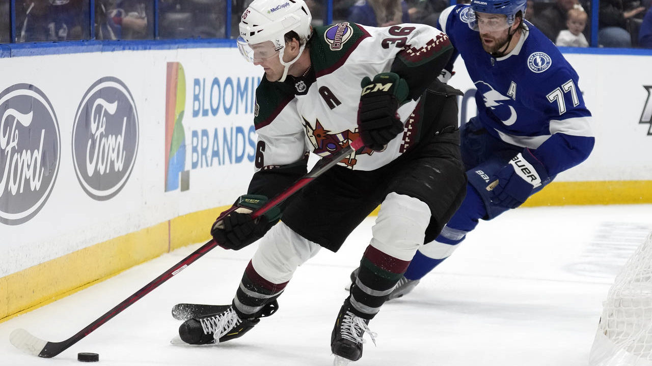 Arizona Coyotes right wing Christian Fischer (36) moves the puck in front of Tampa Bay Lightning de...
