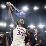 FILE - Kansas guard Ochai Agbaji celebrates after their win against North Carolina in a college basketball game at the finals of the Men's Final Four NCAA tournament, April 4, 2022, in New Orleans. (AP Photo/Brynn Anderson, File)