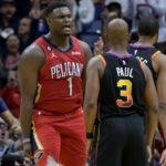 New Orleans Pelicans forward Zion Williamson (1) yells at Phoenix Suns guard Chris Paul (3) after a slam dunk in the first half of an NBA basketball game in New Orleans, Friday, Dec. 9, 2022. (AP Photo/Matthew Hinton)