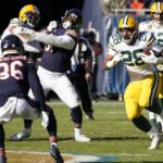 
              Green Bay Packers' AJ Dillon runs during the first half of an NFL football game against the Chicago Bears Sunday, Dec. 4, 2022, in Chicago. (AP Photo/Charles Rex Arbogast)
            