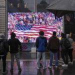 
              Fans watch a broadcast of the United States World Cup soccer game against Netherlands at the Oculus Plaza, Saturday, Dec. 3, 2022, New York. (AP Photo/Yuki Iwamura)
            