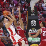 
              Arizona guard Pelle Larsson (3) is fouled by Indiana forward Malik Reneau (5) while attempting to shoot during the first half of an NCAA college basketball game Saturday, Dec. 10, 2022, in Las Vegas. (AP Photo/Chase Stevens)
            