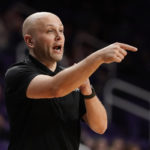 Abilene Christian head coach Brette Tanner talks to his players during the first half of an NCAA college basketball game against Kansas State Tuesday, Dec. 6, 2022, in Manhattan, Kan. (AP Photo/Charlie Riedel)