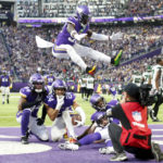 
              Minnesota Vikings safety Camryn Bynum (24) celebrates with teammates after intercepting a pass during the second half of an NFL football game against the New York Jets, Sunday, Dec. 4, 2022, in Minneapolis. The Vikings won 27-22. (AP Photo/Bruce Kluckhohn)
            
