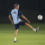 
              Spain's head coach Luis Enrique plays with a ball as his team prepares to work out during a training session at Qatar University, in Doha, Qatar, Friday, Dec. 2, 2022. Spain will play against Morocco in the round of 16 knockout round of the World Cup soccer tournament on Dec. 6. (AP Photo/Julio Cortez)
            