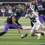 Kansas State running back Deuce Vaughn (22) can't hold onto a pass in front of TCU safety Millard Bradford (28) in the first half of the Big 12 Conference championship NCAA college football game, Saturday, Dec. 3, 2022, in Arlington, Texas. (AP Photo/LM Otero)