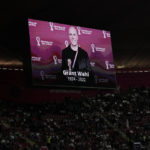 
              A tribute to journalist Grant Wahl is show on a screen before the World Cup quarterfinal soccer match between England and France, at the Al Bayt Stadium in Al Khor, Qatar, Saturday, Dec. 10, 2022. Wahl, one of the most well-known soccer writers in the United States, died early Saturday Dec. 10, 2022 while covering the World Cup match between Argentina and the Netherlands. (AP Photo/Hassan Ammar)
            