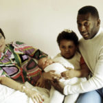 
              FILE - Brazilian soccer star Pele, his wife Rosemeri pose for a photo with their daughter Kelly, and newborn son Edson, in an unknown location in Brazil in 1976. Pelé, the Brazilian king of soccer who won a record three World Cups and became one of the most commanding sports figures of the last century, died in Sao Paulo on Thursday, Dec. 29, 2022. He was 82.  (AP Photo File)
            