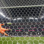 
              England's Harry Kane scores his side's first goal from the penalty spot past France's goalkeeper Hugo Lloris during the World Cup quarterfinal soccer match between England and France, at the Al Bayt Stadium in Al Khor, Qatar, Saturday, Dec. 10, 2022. (AP Photo/Frank Augstein)
            