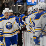 Buffalo Sabres Jeff Skinner (53) gets high-ives from teammates after scoring a goal against the Arizona Coyotes in the first period during an NHL hockey game, Saturday, Dec. 17, 2022, in Tempe, Ariz. (AP Photo/Darryl Webb)