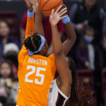 Stanford forward Kiki Iriafen, right, blocks a shot by Tennessee guard Jordan Horston during the first half of an NCAA college basketball game in Stanford, Calif., Sunday, Dec. 18, 2022. (AP Photo/Godofredo A. Vásquez)