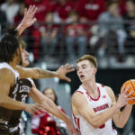 
              Wisconsin's Tyler Wahl (5) is trapped by Lehigh's Jalin Sinclair, left, Dominic Parolin (35) during the first half of an NCAA college basketball game Thursday, Dec. 15, 2022, in Madison, Wis. (AP Photo/Andy Manis)
            