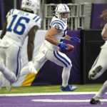 Indianapolis Colts linebacker JoJo Domann (57) returns a blocked punt for a touchdown during the first half of an NFL football game against the Minnesota Vikings, Saturday, Dec. 17, 2022, in Minneapolis. (AP Photo/Abbie Parr)