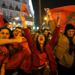 Morocco fans celebrate in the central Puerta del Sol in Madrid, Spain, Tuesday, Dec. 6, 2022. Morocco beat Spain on penalties during a round of 16 World Cup soccer tournament in Qatar. (AP Photo/Andrea Comas)