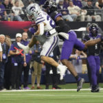 Kansas State running back Deuce Vaughn (22) catches a pass while defended by TCU safety Mark Perry (3) in the first half of the Big 12 Conference championship NCAA college football game, Saturday, Dec. 3, 2022, in Arlington, Texas. (AP Photo/LM Otero)