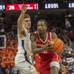 
              Houston guard Tramon Mark (12) move past a Virginia defender during the first half of an NCAA college basketball game in Charlottesville, Va., Saturday, Dec. 17, 2022. (AP Photo/Erin Edgerton)
            