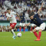 
              France's Olivier Giroud scores the opening goal during the World Cup round of 16 soccer match between France and Poland, at the Al Thumama Stadium in Doha, Qatar, Sunday, Dec. 4, 2022. (AP Photo/Ebrahim Noroozi)
            