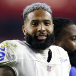 
              FILE - Los Angeles Rams wide receiver Odell Beckham Jr. walks off the field following an NFL football game against the Arizona Cardinals, Monday, Dec. 13, 2021, in Glendale, Ariz. The bankruptcy of FTX and the arrest of its founder and former CEO are raising new questions about the role celebrity athletes such as Tom Brady, Steph Curry, Naomi Osaka, Beckham Jr., and others played in lending legitimacy to the largely unregulated landscape of crypto, while also reframing the conversation about just how costly blind loyalty to favorite players or teams can be for the average fan. (AP Photo/Ralph Freso, File)
            