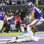 Minnesota Vikings tight end T.J. Hockenson (87) catches a two-point conversion pass over Indianapolis Colts linebacker Bobby Okereke during the second half of an NFL football game, Saturday, Dec. 17, 2022, in Minneapolis. (AP Photo/Abbie Parr)