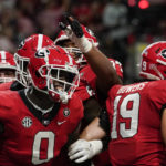 Georgia tight end Darnell Washington (0) celebrates after scoring a touchdown in the first half of the Southeastern Conference championship NCAA college football game, Saturday, Dec. 3, 2022, in Atlanta. (AP Photo/Brynn Anderson)
