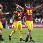 
              FILE - Southern California defensive lineman Tuli Tuipulotu celebrates stopping California on fourth down during the first half of an NCAA college football game Saturday, Nov. 5, 2022, in Los Angeles. Tuipulotu was selected to The Associated Press All-America team released Monday, Dec. 12, 2022. (AP Photo/John McCoy, File)
            