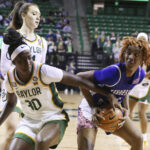 Tennessee State forward Lyric Cole (24) pulls in a rebound over Baylor guard Catarina Ferreira (30) in the first half of an NCAA college basketball game, Thursday, Dec. 15, 2022, in Waco, Texas. (Rod Aydelotte/Waco Tribune-Herald, via AP)