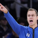 Duke head coach Jon Scheyer works the bench during the second half of the team's NCAA college basketball game against Iowa in the Jimmy V Classic, Tuesday, Dec. 6, 2022, in New York. (AP Photo/John Minchillo)