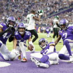 
              Minnesota Vikings safety Camryn Bynum (24) celebrates with teammates after intercepting a pass during the second half of an NFL football game against the New York Jets, Sunday, Dec. 4, 2022, in Minneapolis. The Vikings won 27-22. (AP Photo/Bruce Kluckhohn)
            
