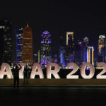 People take photos at the Corniche during the 2022 FIFA World Cup, in Doha, Nov. 23, 2022. (AP Photo/Ashley Landis)