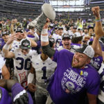 Kansas State players celebrate with the trophy after winning the Big 12 Conference championship NCAA college football game against TCU, Saturday, Dec. 3, 2022, in Arlington, Texas. (AP Photo/LM Otero)