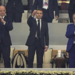 FIFA President Gianni Infantino, left, and French President Emmanuel Macron, center, arrive for the World Cup semifinal soccer match between France and Morocco at the Al Bayt Stadium in Al Khor, Qatar, Wednesday, Dec. 14, 2022. (AP Photo/Martin Meissner)