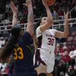 
              Stanford guard Haley Jones shoots next to California forward Peanut Tuitele during the first half of an NCAA college basketball game in Stanford, Calif., Friday, Dec. 23, 2022. (AP Photo/Godofredo A. Vásquez)
            