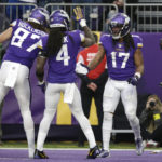 Minnesota Vikings wide receiver K.J. Osborn (17) celebrates with teammates T.J. Hockenson (87) and Dalvin Cook (4) after catching a 2-yard touchdown pass during the second half of an NFL football game against the Indianapolis Colts, Saturday, Dec. 17, 2022, in Minneapolis. (AP Photo/Andy Clayton-King)