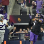 TCU wide receiver Quentin Johnston (1) reaches for a pass in front of Kansas State cornerback Julius Brents (23) in the first half of the Big 12 Conference championship NCAA college football game, Saturday, Dec. 3, 2022, in Arlington, Texas. (AP Photo/LM Otero)