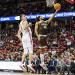 
              Lehigh's Tyler Whitney-Sidney (22) shoots ahead of Wisconsin's Tyler Wahl (5) during the first half of an NCAA college basketball game Thursday, Dec. 15, 2022, in Madison, Wis. (AP Photo/Andy Manis)
            