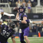
              TCU quarterback Max Duggan (15) throws under pressure from Kansas State defensive end Felix Anudike-Uzomah (91) and linebacker Austin Moore (41) in the first half of the Big 12 Conference championship NCAA college football game, Saturday, Dec. 3, 2022, in Arlington, Texas. TCU running back Kendre Miller (33) is at bottom. (AP Photo/LM Otero)
            