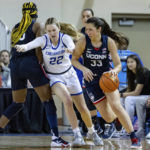 
              UConn's Caroline Ducharme (33) drives as Creighton's Carly Bachelor (22) is screened during the first half of an NCAA college basketball game Wednesday, Dec. 28, 2022, in Omaha, Neb. (AP Photo/John Peterson)
            