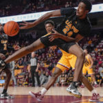 Arkansas-Pine Bluff guard AC Curry (24) passes the ball before going out of bounds against Minnesota during the first half of an NCAA college basketball game on Wednesday, Dec. 14, 2022, in Minneapolis. (AP Photo/Craig Lassig)