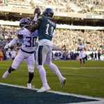 
              Philadelphia Eagles' A.J. Brown catches the ball for a touchdown in front of Tennessee Titans' Tre Avery during the second half of an NFL football game, Sunday, Dec. 4, 2022, in Philadelphia. (AP Photo/Matt Slocum)
            