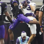 Kansas State wide receiver RJ Garcia II (3) catches a touchdown pass in front of TCU safety Bud Clark (26) in the second half of the Big 12 Conference championship NCAA college football game, Saturday, Dec. 3, 2022, in Arlington, Texas. (AP Photo/LM Otero)