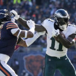 
              Philadelphia Eagles' A.J. Brown, right, tries to get past Chicago Bears' Jaquan Brisker during the first half of an NFL football game against the Chicago Bears, Sunday, Dec. 18, 2022, in Chicago. (AP Photo/Nam Y. Huh)
            
